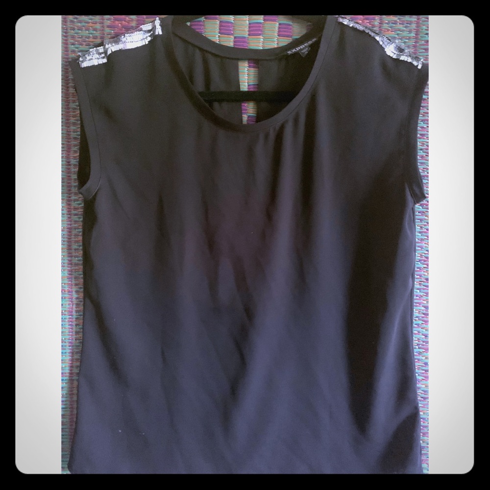 Sleeveless black dress top